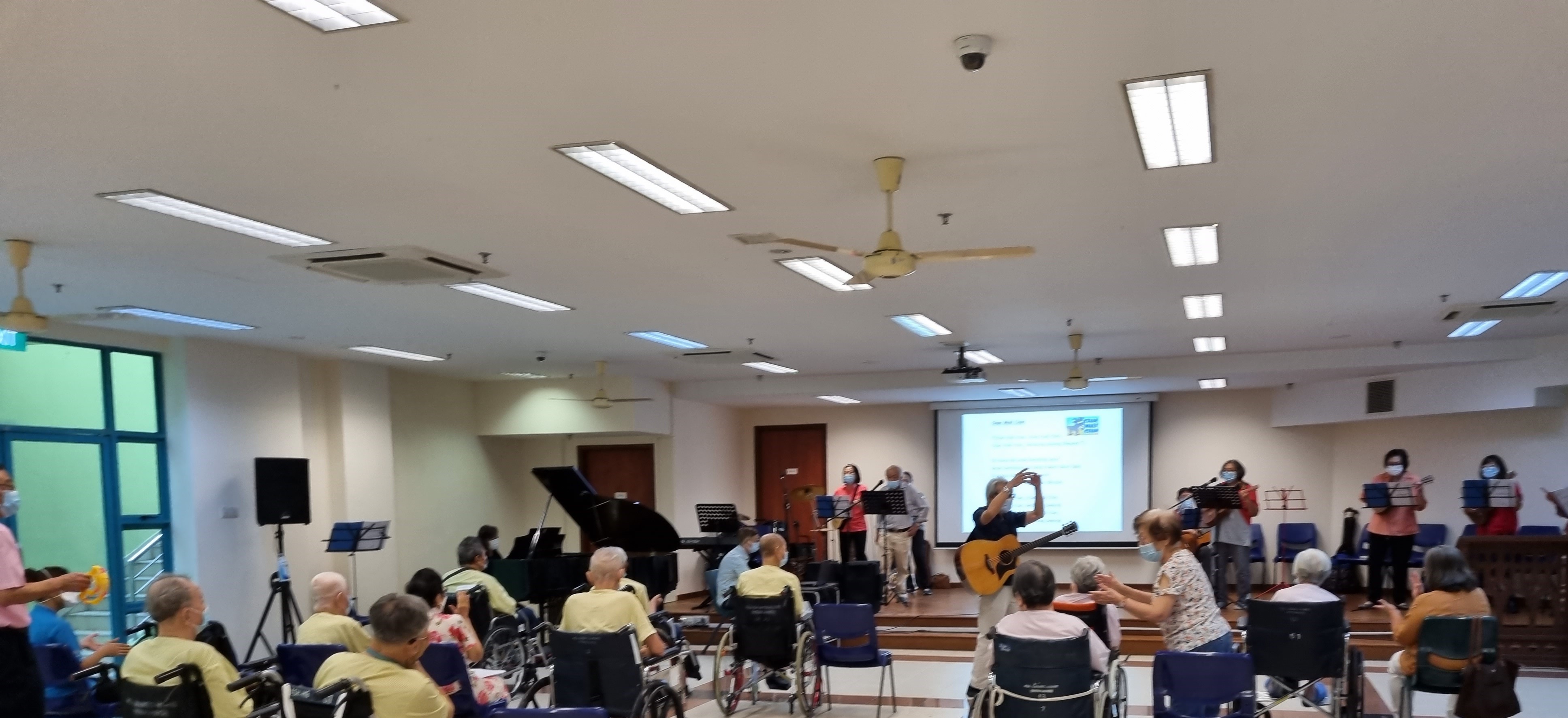 NUS Sing Along Alumni volunteering at All Saints Home (Hougang)