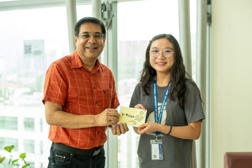 Prof Sanjay Swarup, NERI Director with the 1st Prize lucky draw winner of the Total WSH survey.