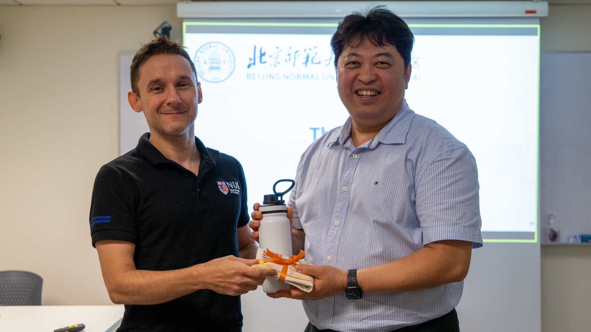 Assoc. Prof. Olivier Lefebvre presents NERI souvenirs to Prof. Ng How Yong