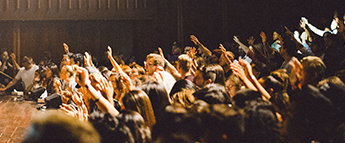 students raising hands