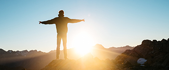 man standing on top of mound