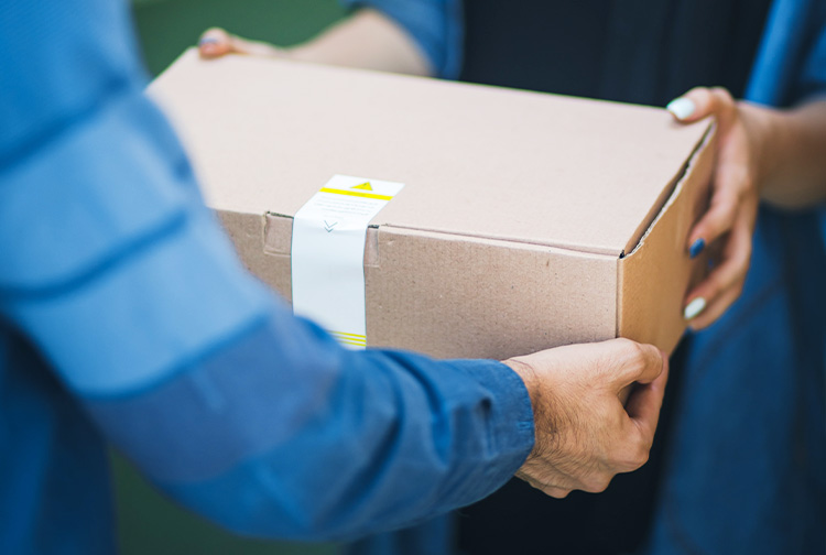 person giving brown box